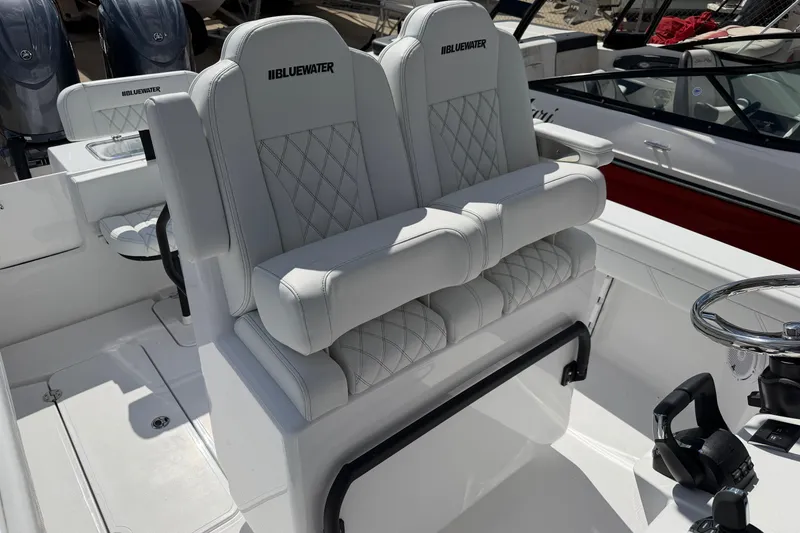 Slide: The Image of Luxurious seating on 2026 Bluewater Sportfishing 25T boat, featuring diamond-stitched upholstery. - 36