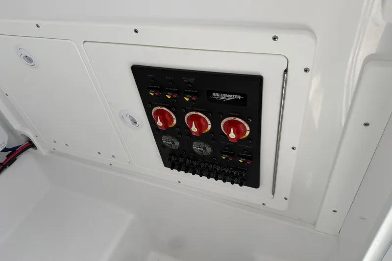 Slide: The Image of Control panel of 2026 Bluewater Sportfishing 25T boat, featuring switches and dials. - 38