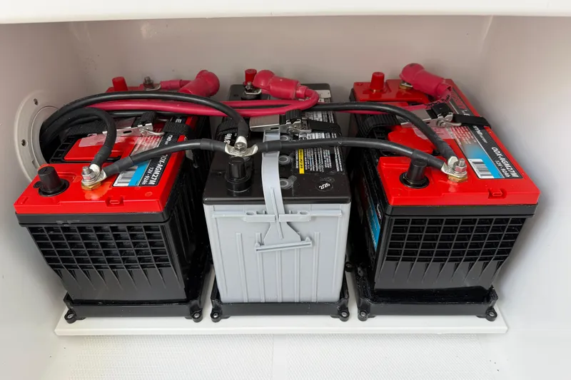 Slide: The Image of Batteries installed in a 2026 Bluewater Sportfishing 25T boat, showcasing electrical setup. - 39