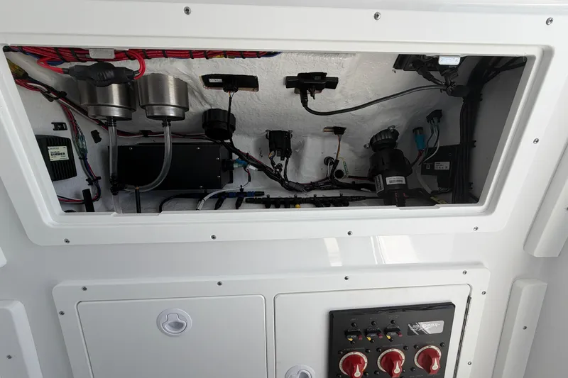 Slide: The Image of Electrical panel and wiring inside a 2026 Bluewater Sportfishing 25T boat. - 41