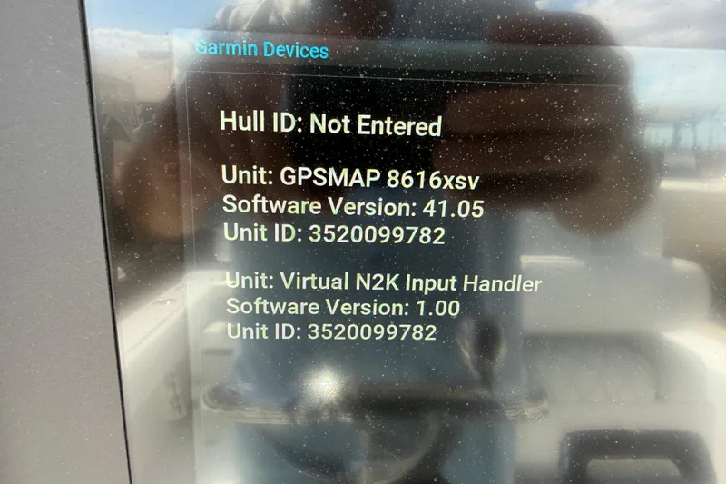 Slide: The Image of Garmin device display on Bluewater Sportfishing 25T, showing software versions and unit IDs. - 42