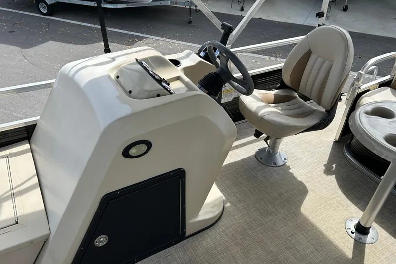 Slide: The Image of 2023 Lowe Ultra 162 Fish & Cruise boat interior with steering console and seating. - 11