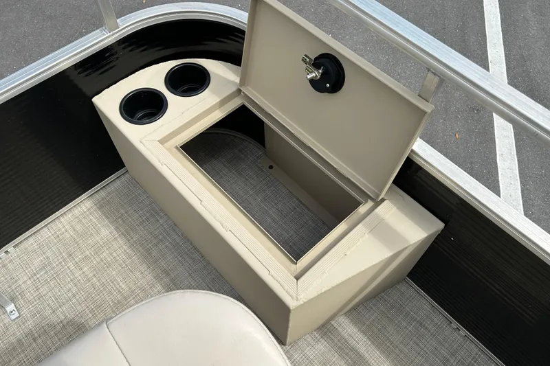 Slide: The Image of 2023 Lowe Ultra 162 Fish & Cruise boat storage compartment with cup holders. - 14