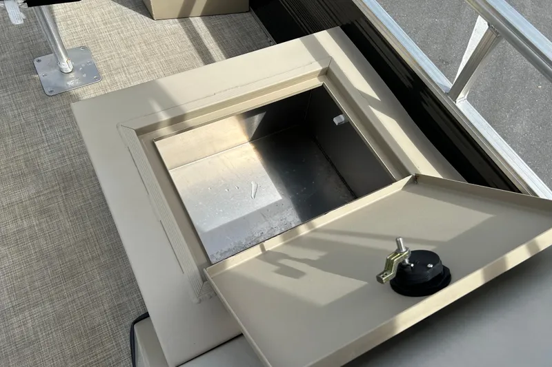 Slide: The Image of 2023 Lowe Ultra 162 Fish & Cruise boat storage compartment with open lid. - 15