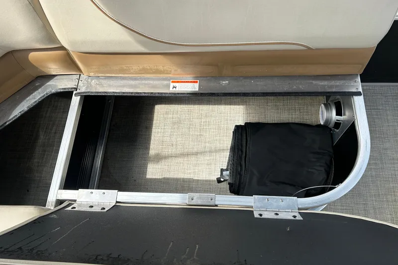 Slide: The Image of Storage compartment in 2023 Lowe Ultra 162 Fish & Cruise boat, featuring organized interior space. - 17