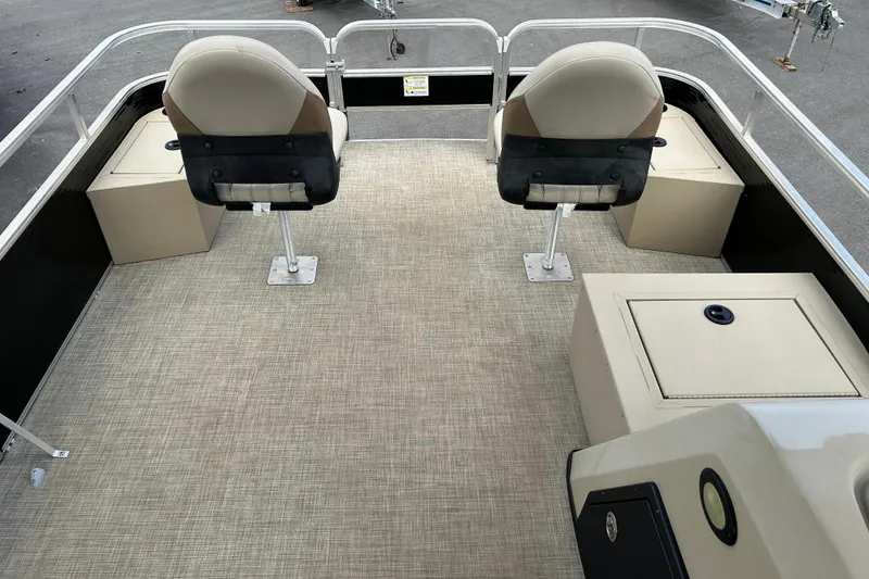 Slide: The Image of 2023 Lowe Ultra 162 Fish & Cruise boat interior with seating and storage compartments. - 6