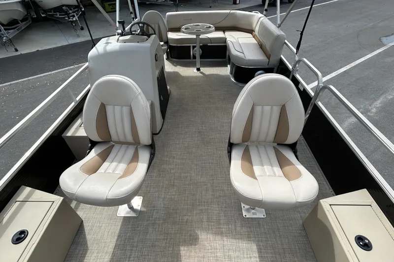 Slide: The Image of 2023 Lowe Ultra 162 Fish & Cruise boat interior with seating and steering console. - 9