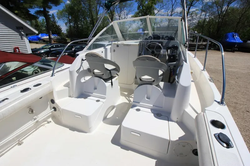 Slide: The Image of 2008 Trophy 2302 Walkaround boat interior with seating and steering console. - 10