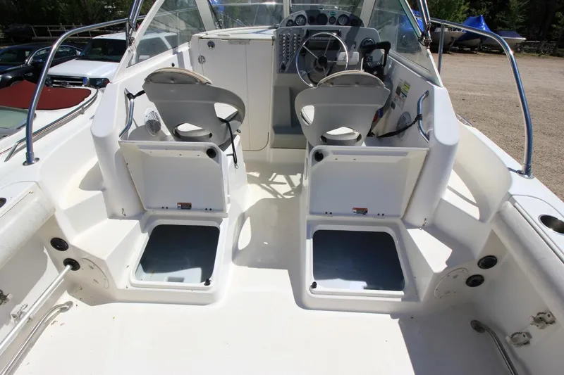 Slide: The Image of 2008 Trophy 2302 Walkaround boat interior with dual seats and steering console. - 11
