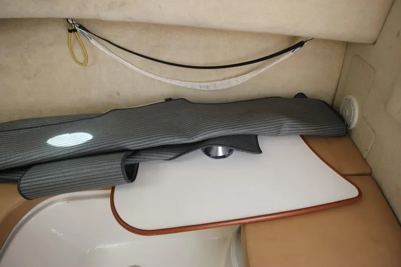 Slide: The Image of Interior of 2008 Trophy 2302 Walkaround boat with storage and seating area. - 18