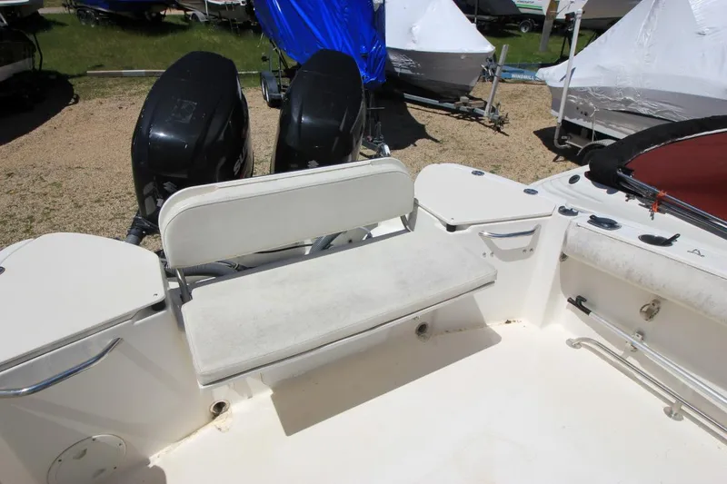Slide: The Image of 2008 Trophy 2302 Walkaround boat interior with seating and dual outboard motors. - 21