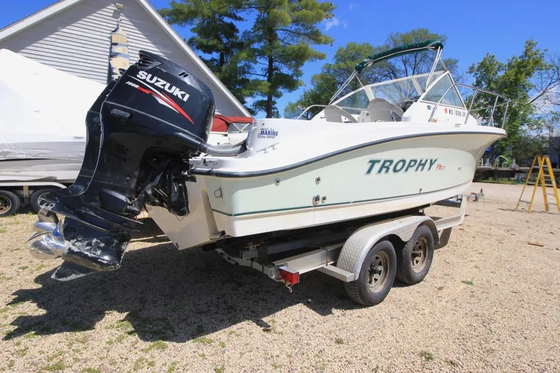 Slide: The Image of 2008 Trophy 2302 Walkaround boat on trailer with Suzuki outboard motor. - 3