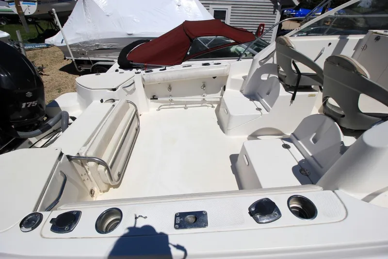 Slide: The Image of 2008 Trophy 2302 Walkaround boat interior with seating and storage compartments. - 6
