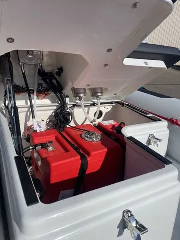 Slide: The Image of Zodiac Boats Open 4.2 2026 with open storage and red batteries. - 8