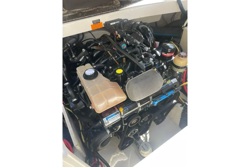 Slide: The Image of Engine compartment of a 2005 Chaparral 265 SSi boat, showcasing detailed components. - 26