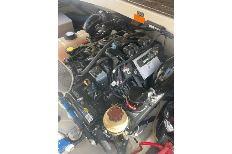 Slide: The Image of Engine compartment of a 2005 Chaparral 265 SSi boat, showcasing detailed components. - 28