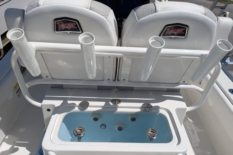 Slide: The Image of 2023 Ranger 2660 Bay boat interior with rod holders and livewell. - 6