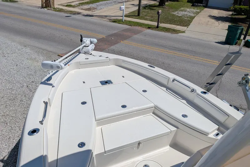 Slide: The Image of 2023 Ranger 2660 Bay boat deck with storage compartments and trolling motor. - 8