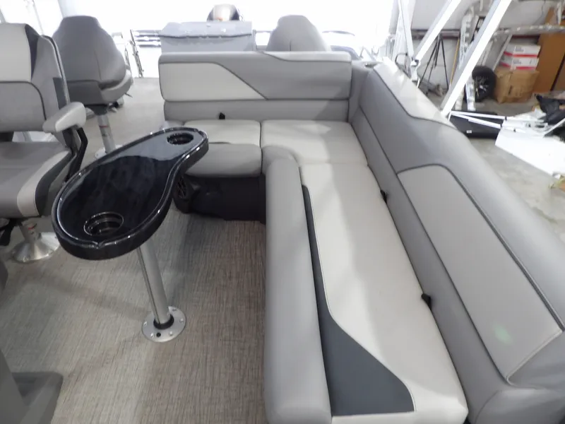 Slide: The Image of Interior of 2026 Avalon Venture Quad Fish with gray seating and table. - 15