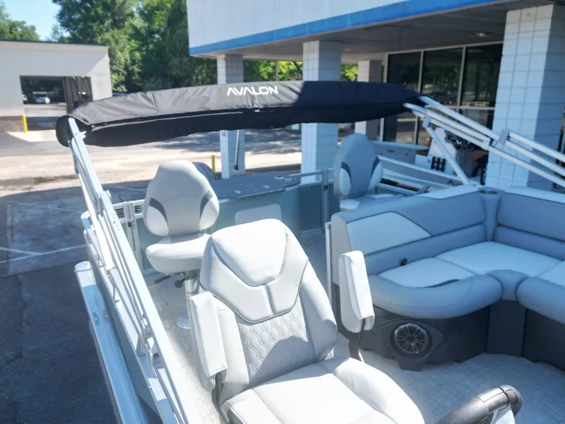 Slide: The Image of 2026 Avalon Venture 85 Quad Fish pontoon boat with gray seating. - 18