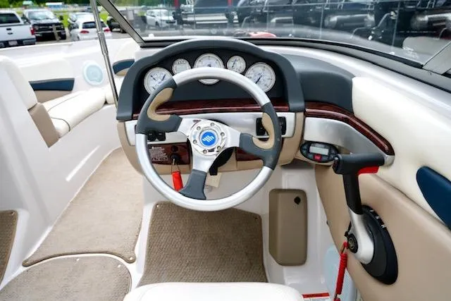Slide: The Image of Interior view of 2006 Four Winns 210 Horizon boat dashboard and steering wheel. - 13