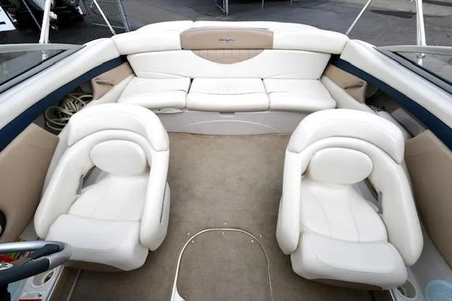 Slide: The Image of Interior of a 2006 Four Winns 210 Horizon boat with white seating. - 14