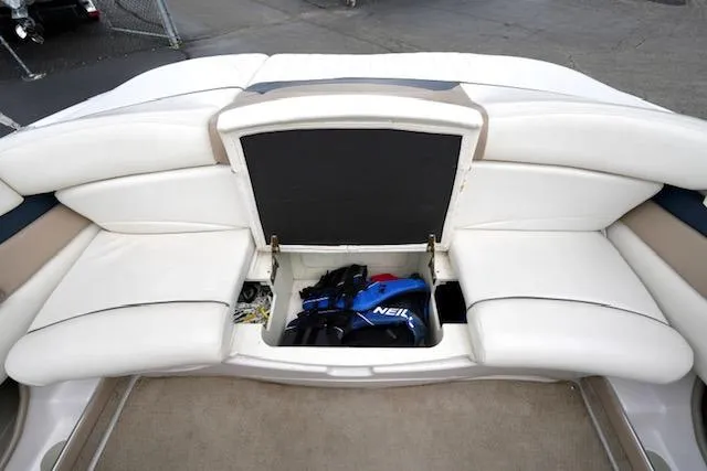 Slide: The Image of Storage compartment in 2006 Four Winns 210 Horizon boat with white seating. - 15