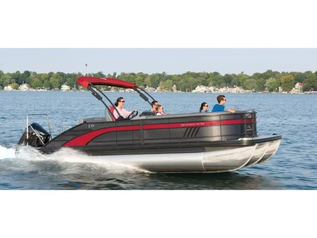 The Image of 2021 Bennington 23 LSB pontoon boat cruising on a lake. - 1