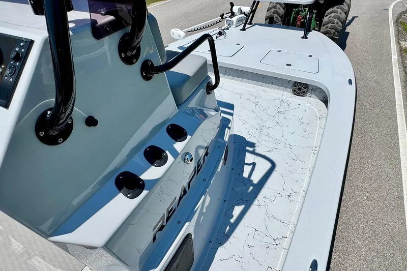 Slide: The Image of 2022 Majek 24 Reaper boat interior with sleek design and modern features. - 13