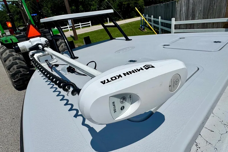 Slide: The Image of 2022 Majek 24 Reaper boat with Minn Kota trolling motor on deck. - 15