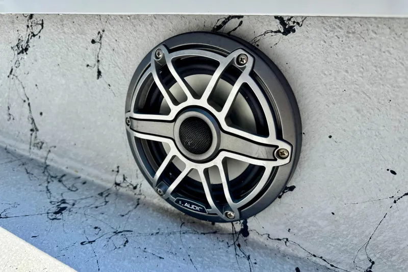 Slide: The Image of JL Audio speaker on 2022 Majek 24 Reaper boat with splatter paint design. - 17