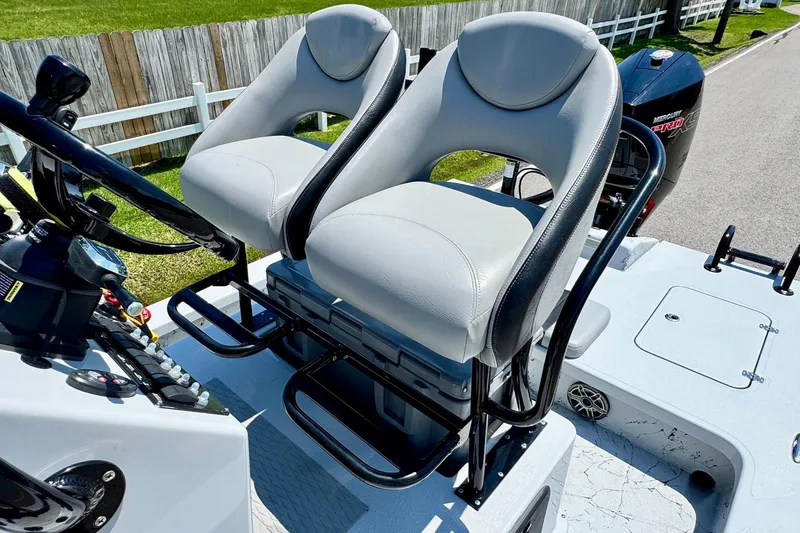 Slide: The Image of 2022 Majek 24 Reaper boat with dual seats and steering console. - 9