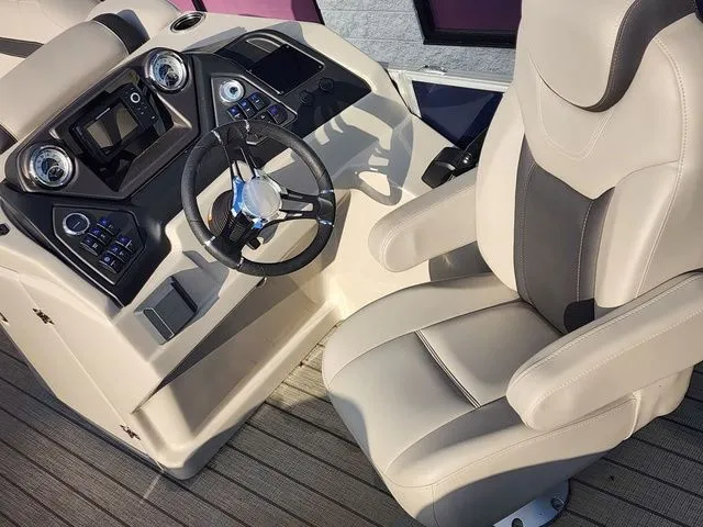 Slide: The Image of Interior of a 2022 Sylvan L-1 LZ boat with steering console. - 10