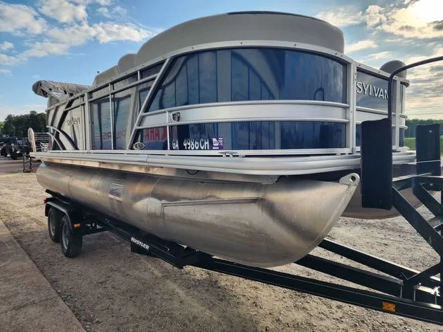 Slide: The Image of 2022 Sylvan L-1 LZ pontoon boat on trailer at sunset. - 4