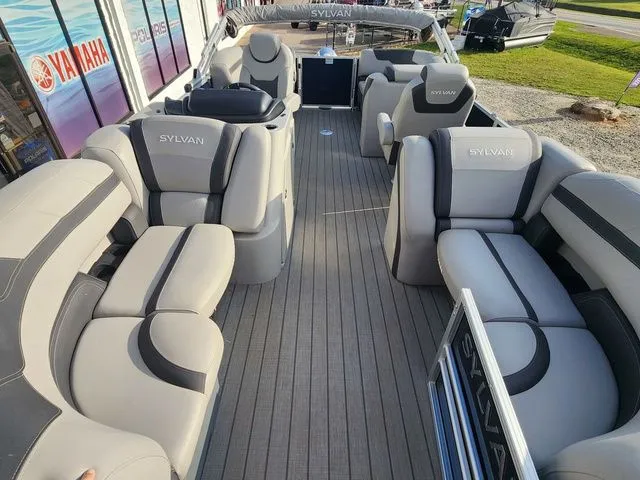Slide: The Image of Interior view of a 2022 Sylvan L-1 LZ pontoon boat with gray seating. - 6