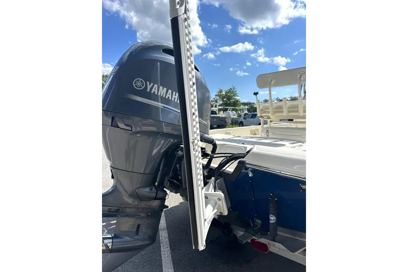 Slide: The Image of 2015 Skeeter SX220 T boat with Yamaha outboard motor under a clear blue sky. - 11