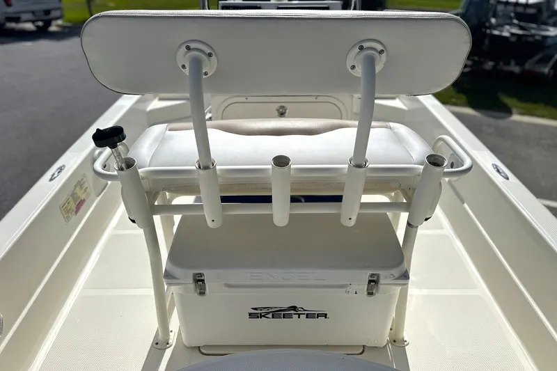 Slide: The Image of 2015 Skeeter SX220 T boat interior with seating and Engel cooler. - 14