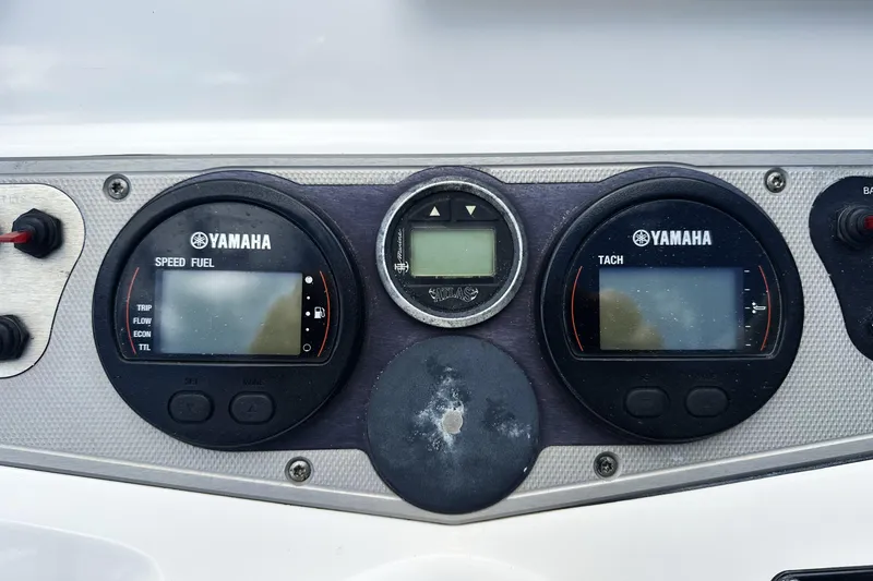 Slide: The Image of Dashboard of a 2015 Skeeter SX220 T boat with Yamaha gauges. - 20