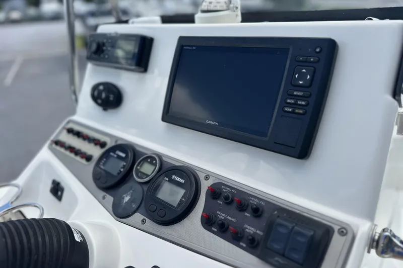 Slide: The Image of Control panel of a 2015 Skeeter SX220 T boat with Garmin navigation system. - 21