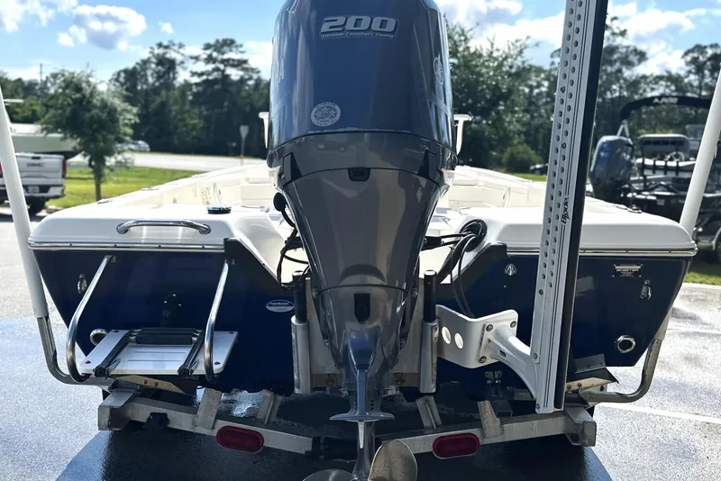 Slide: The Image of 2015 Skeeter SX220 T boat with Yamaha 200 engine, rear view on trailer. - 5