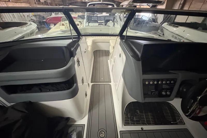 Slide: The Image of Interior view of a 2021 Cobalt R30 boat, showcasing cockpit and seating area. - 12
