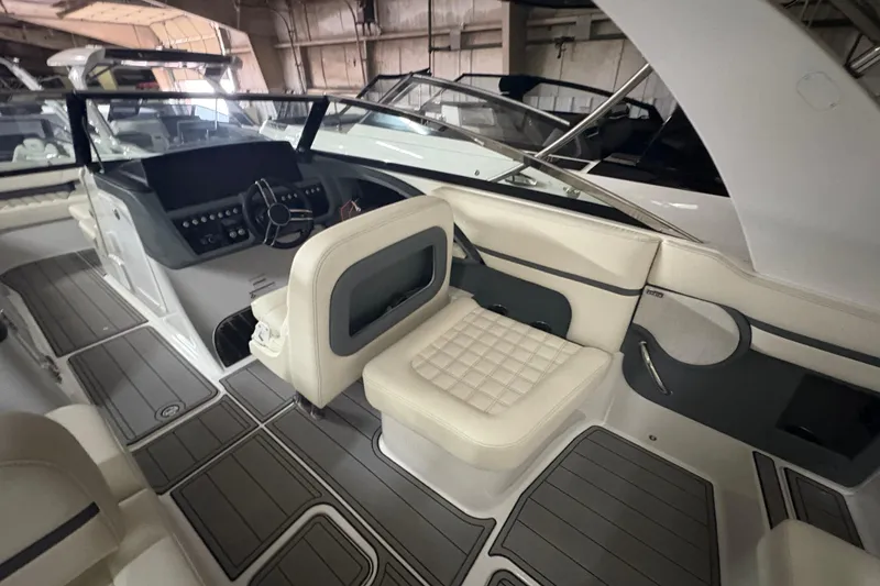 Slide: The Image of Interior of a 2021 Cobalt R30 boat with luxurious seating and modern dashboard. - 15