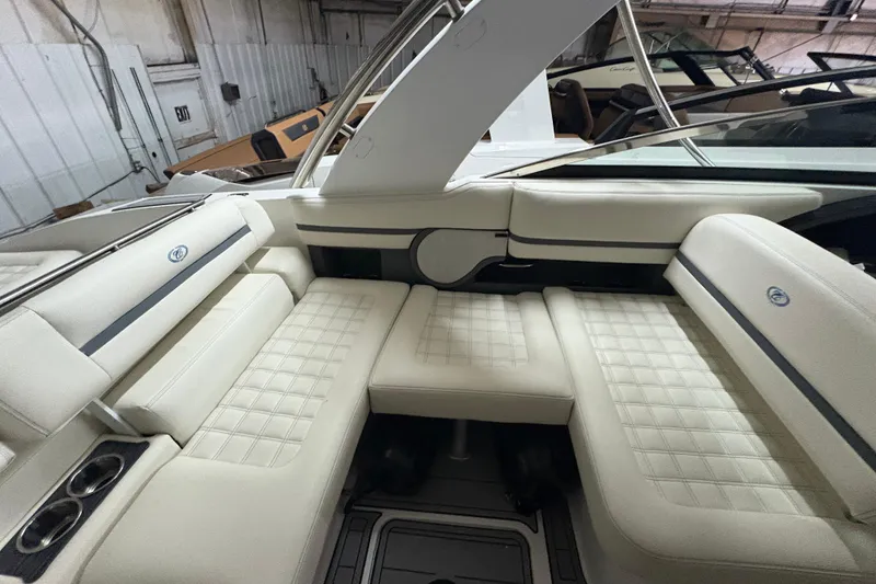 Slide: The Image of Luxurious interior seating of a 2021 Cobalt R30 boat, featuring elegant white upholstery. - 18