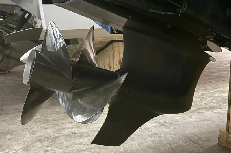 Slide: The Image of Close-up of a 2021 Cobalt R30 boat propeller in a garage setting. - 21