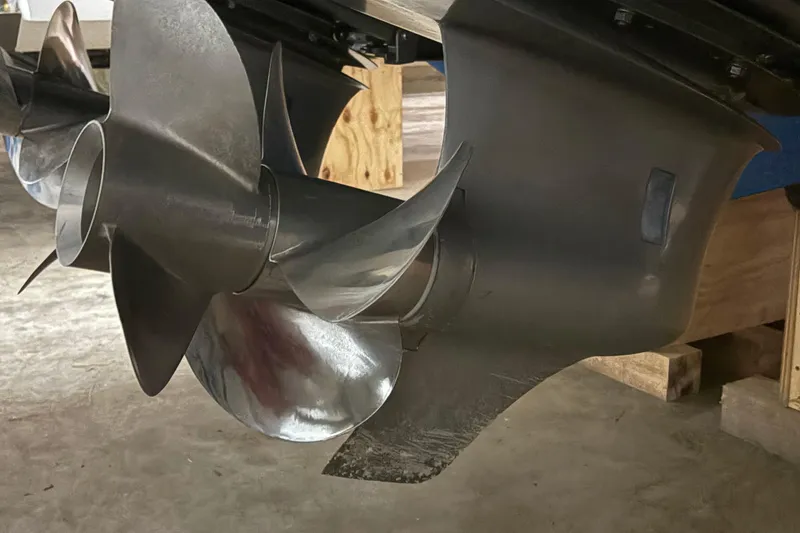 Slide: The Image of Close-up of a 2021 Cobalt R30 boat propeller in a workshop setting. - 22