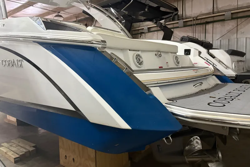 Slide: The Image of 2021 Cobalt R30 boat in storage, showcasing sleek design and modern features. - 4