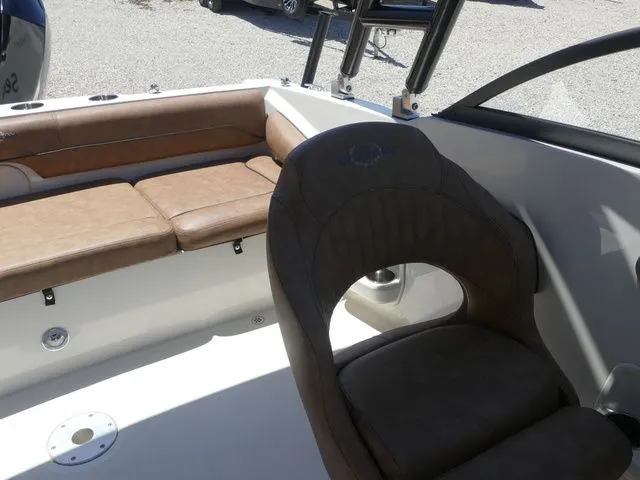 Slide: The Image of Interior of a 2020 Stingray 201 DS boat with brown seating. - 19