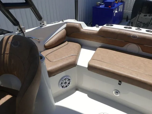 Slide: The Image of Interior of 2020 Stingray 201 DS boat with beige upholstery. - 20