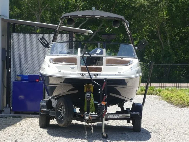 Slide: The Image of 2020 Stingray 201 DS boat on trailer outdoors. - 4