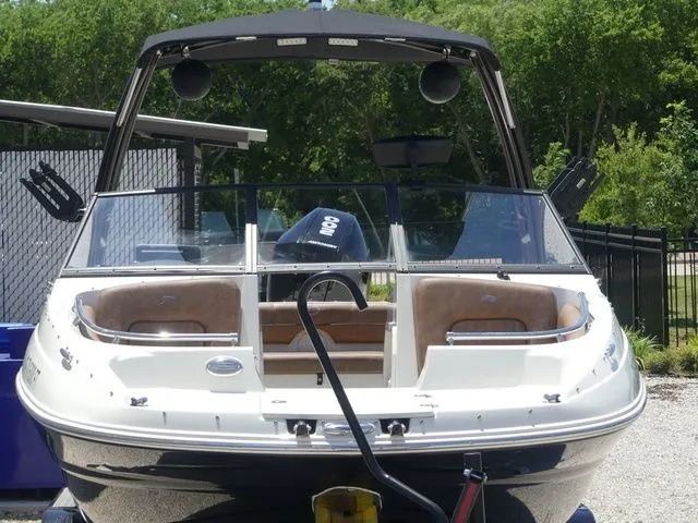 Slide: The Image of 2020 Stingray 201 DS boat parked outdoors. - 5